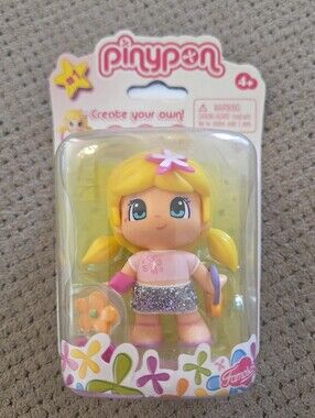 Pinypon Famosa 2.5" Doll is a cute and playful toy featuring blonde hair, a pink